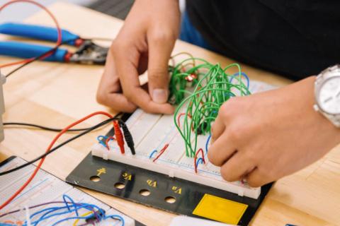 Technician working on electronics components