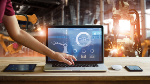 Employee working on a laptop in a Manufacturing Industry